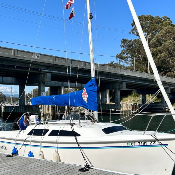 a boat is docked in front of a building