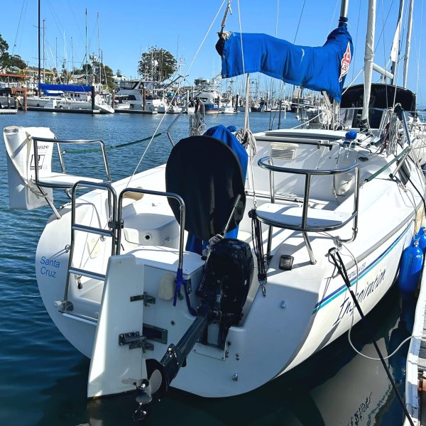 a boat is docked next to a body of water