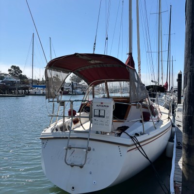 a boat is docked next to a body of water